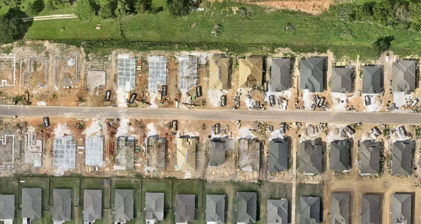 Orthomosaic of an early construction stage with house pads and foundations poured